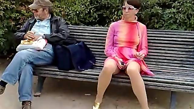Sweet babe is posing naked on the street