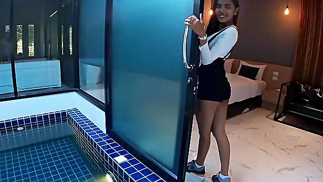 Thai babe seductively strips off her bra by the pool in POV heat