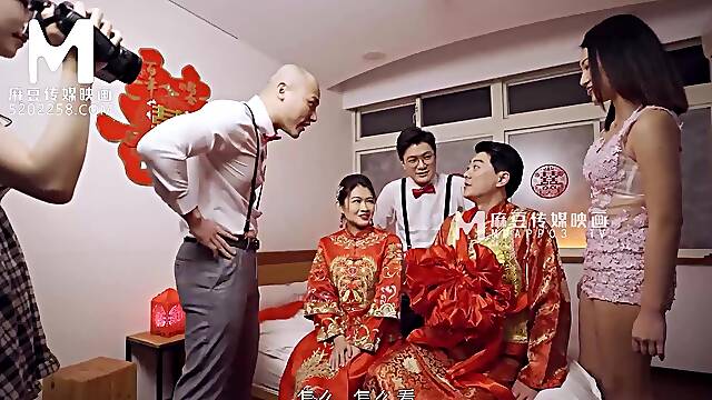 Sweet asian teen gets shared by two lustful guys in bed after the wedding