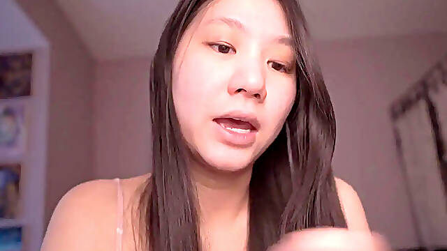 Innocent Asian girl reads scripture while touching herself