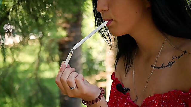 Seductive Russian Beauty Smoking Slim Cigarette Outdoors