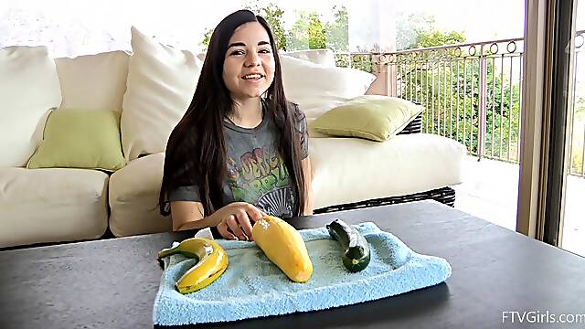 Naughty chick pleasures her pussy with a banana and a cucumber